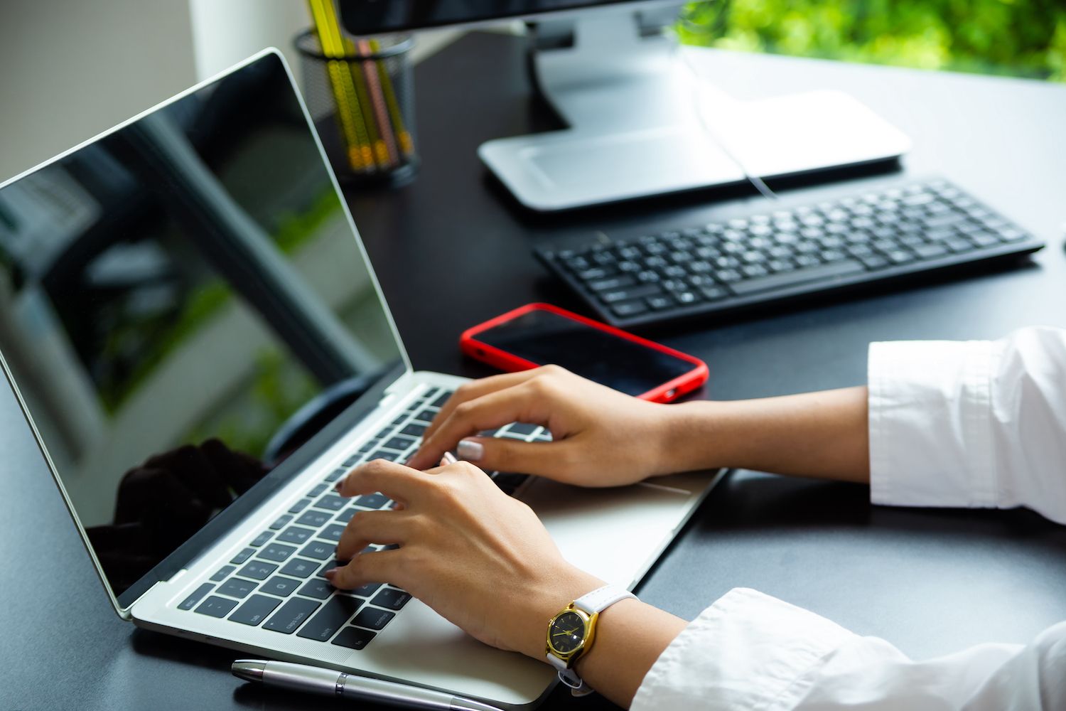 entrepreneurs looking at brand guidelines on a computer