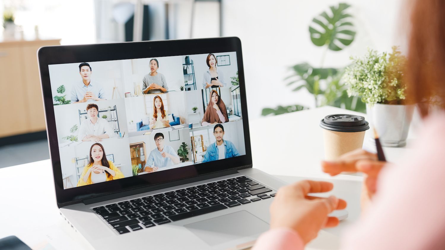 working out on a yoga mat in front of a computer